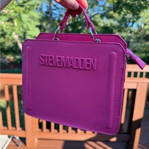 NWOT!! Steve Madden Fuchsia purse. Includes pouch and 3 cross body straps!!